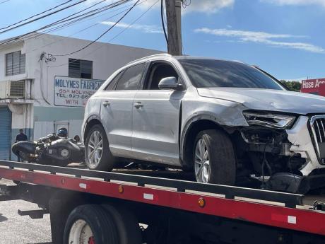 The Audi motorcar that was the subject of yesterday morning’s attack on a wrecker along with the motorcycle used by the two gunmen who were killed in the incident. 