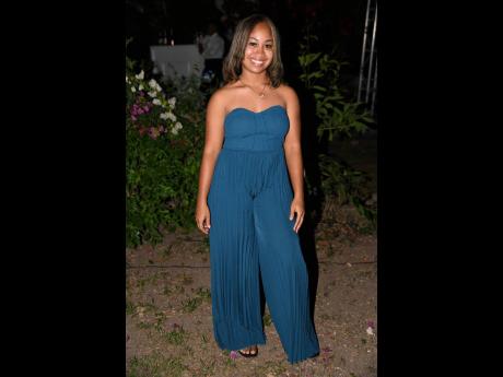 Telecommunications specialist Shenae Watson jumps into the evening’s fashion festivities in this emerald blue jumpsuit.