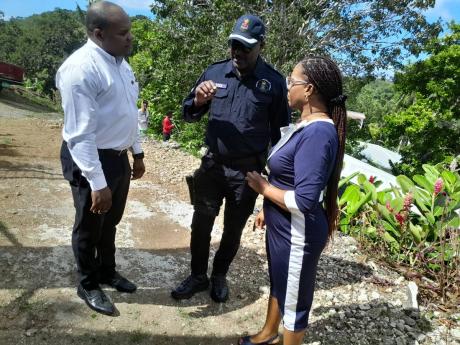 From left to right: Ricardo Fairman, the president of National Police Youth Club (PYC) Superintendent Andrew Nish, the police commander for Hanover; and Fania Davis, Hanover Divisional PYC Chairman, in discussion at the Hanover Divisional PYC Council Appre