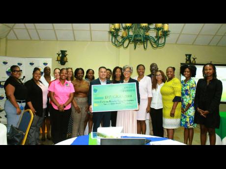 Matthew Samuda (fifth left, front row), minister without portfolio in the Ministry of Economic Growth and Job Creation with responsibility for water, environment, climate change, and the blue and green economies, shares a photo moment with grantees at the 