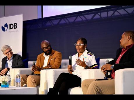 Credit: Contributed Director of the Transformation Implementation Unit (TIU) in the Ministry of Finance and Public Service, Maria Thompson Walters (second right), shares project management best practices during the discussion segment of the Inter-American Development Bank (ID