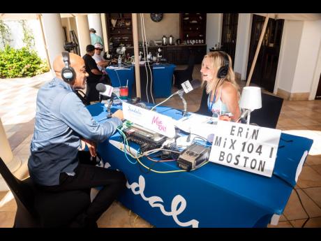 Credit: Contributed Erin O’Malley from WWBX Boston, Mix 104.1 and Rickardo Foster, executive chef, Sandals South Coast.