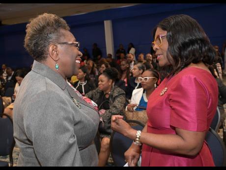 Cabinet Secretary Audrey Sewell (right) with Director of Public Prosecutions Paula Llewellyn at the MIND launch of the Public Sector Learning and Development Policy.