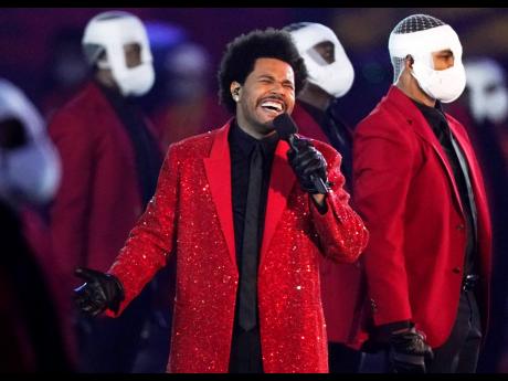 Credit: AP/File The Weeknd performs during the half-time show of the NFL Super Bowl 55 football game between the Kansas City Chiefs and Tampa Bay Buccaneers, on February 7, 2021, in Tampa, Florida.
