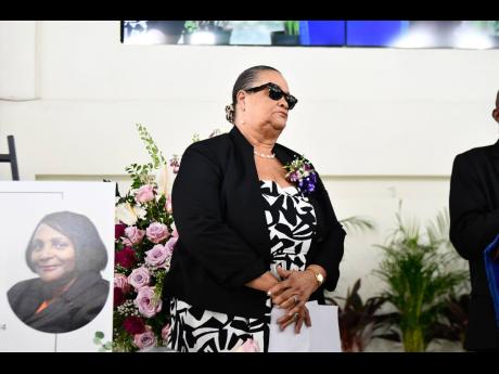 Wyvolyn Gager, former editor in chief at The Gleaner and family friend, prepares to pay tribute during the funeral.