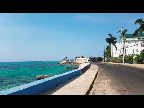 An empty Jimmy Cliff Boulevard, popularly known as the Hip Strip.