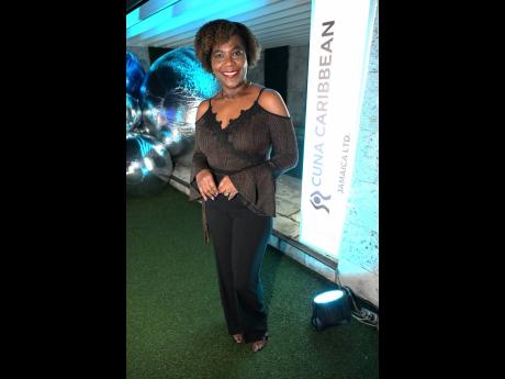Marcia Osborne, group human resource department and administration manager of Jamaica Co-operative Credit Union League, rocks her Afro for this dance party.