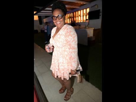 Rocking the night away is Christine Miller, branch manager of C&WJ. 