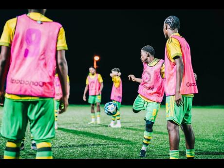 Credit: Courtesy of JFF Media Jamaica’s under-17 Reggae Boyz go through a routine warm-up.