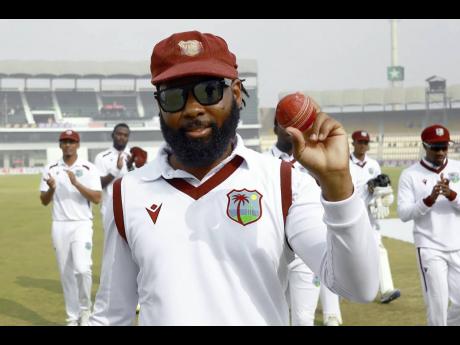 West Indies’ Jomel Warrican raises the ball during the first Test cricket match against Pakistan in Multan, Pakistan, on January 19. 