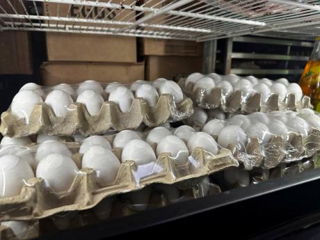 Cartons of eggs sit inside cooler at Norma's Sweets Bakery Tuesday, February 11, 2025, in New Orleans. (AP Photo/Stephen Smith)