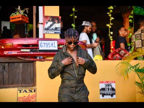 DJ Anash models the Tribe camo overall. 