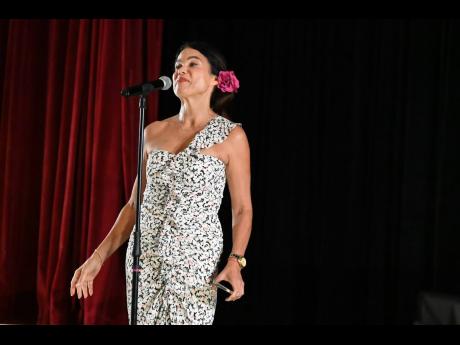Producer Debra Ehrhardt addressing the audience during her storytelling competition at Half Moon in Montego Bay last Saturday.