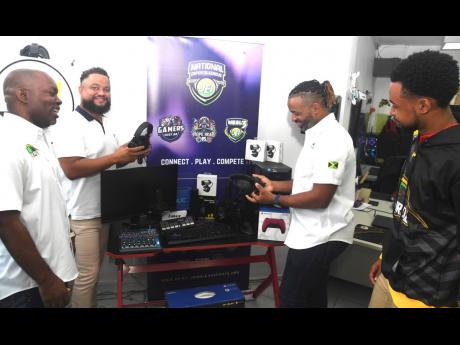 From left: Andrew Johnson, Vice-President, Jamaica eSports Initiative (JEI), Jamaica Olympic Association CEO/Secretary General Ryan Foster, Gregory Moore, JEI President and national representative Alec Afflick during a presentation by the JOA by way of its