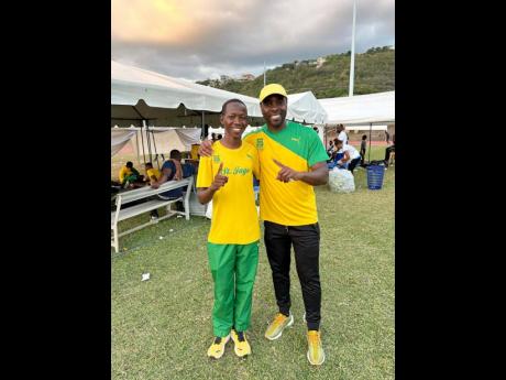 Davaon Spence (right) with St Jago High School athlete Ryan Achua.