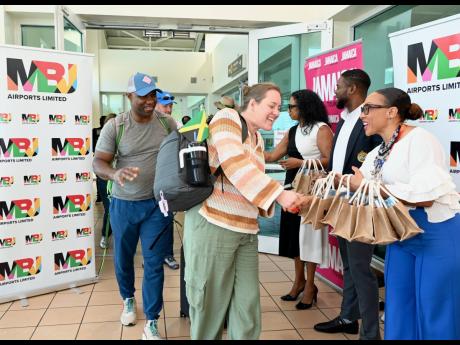 Credit: Ashley Anguin/Photographer Passengers arrive at the Sangster International Airport in Montego Bay, St James, on Avelo Airlines’ inaugural flight from Raleigh-Durham International Airport in North Carolina to Jamaica last Wednesday.