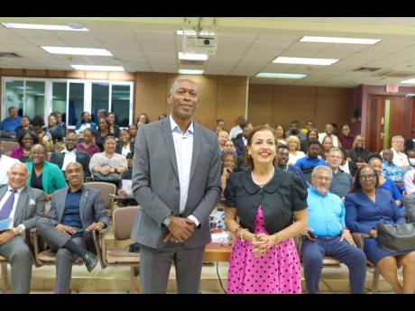 Credit: Director General of the Maritime Authority of Jamaica Betrand Smith and Dr Ann Fenech, president of the Comité Maritime International, share a photo opportunity with attendees at the MAJ-organised maritime lecture on the judicial sale of ships.