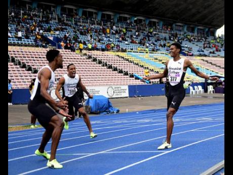 J’Voughnn Blake (right) of Jamaica College crosses the line anchoring the JC 4x800m relay team to a win  and meet record with a  time of 7:24.30 at the Gibson McCook Relays held at the National Stadium on Saturday February 26, 2022.