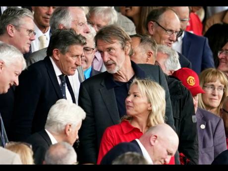 Jim Ratcliffe (centre) in the stands during the English Premier League football match between Manchester United and Arsenal at the Old Trafford Stadium in Manchester, England on Sunday, May 12, 2024. 