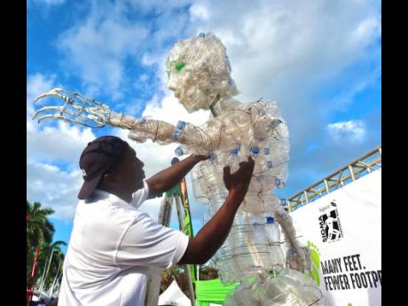 Scheed Cole sculpted ‘The Eco-Champion’ from plastic bottles.