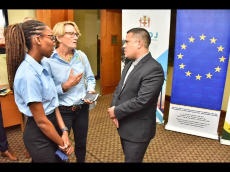 Credit: Contributed Minister without Portfolio in the Ministry of Economic Growth and Job Creation, Matthew Samuda (right), in discussion with chairman of the White River Fish Sanctuary and Marine Association, Belinda Collier Morrow (centre) and sanctuary manager of the White