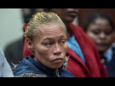 The mother of missing 6-year-old Joslin Smith, Kelly Smith, appears in court in Vredenburg, South Africa, Thursday, March 7, 2024. Smith has been charged with kidnapping and selling or trafficking her daughter in a shocking twist in a case that has enraptu