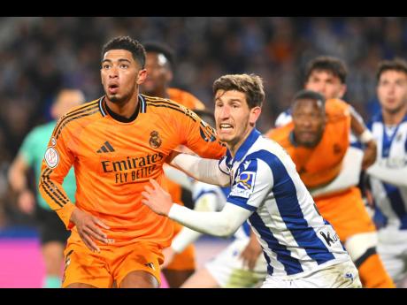 Real Madrid’s Jude Bellingham (left) and Real Sociedad’s Aihen Munoz in action during the Spanish Copa del Rey at the Reale Arena in San Sebastian, Spain on Wednesday, February 26.