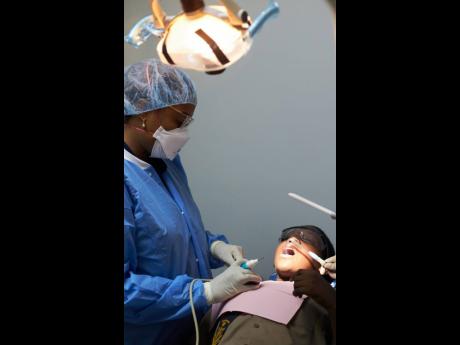 Dr Morissa McCreavy-Roberts in action at her monthly free dental cleaning.