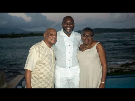 David Morrison is flanked by his parents Andrew Morrison (left) and Jacqueline Morrison.