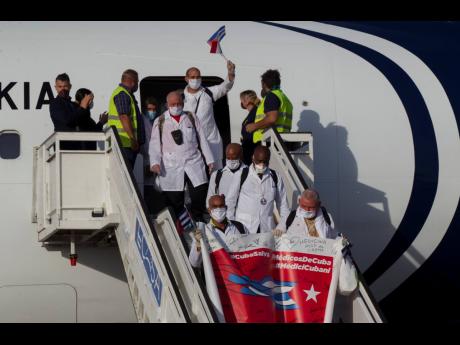 Cuban doctors arrive at the Jose Marti International Airport in Havana, Cuba, on June 8, 2020, after travelling to Italy to help with the COVID-19 emergency response.