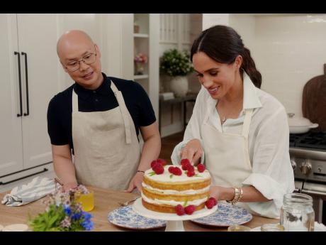 This Netflix image features Daniel Martin and Meghan, Duchess of Sussex, in a scene from ‘With Love, Meghan’.
