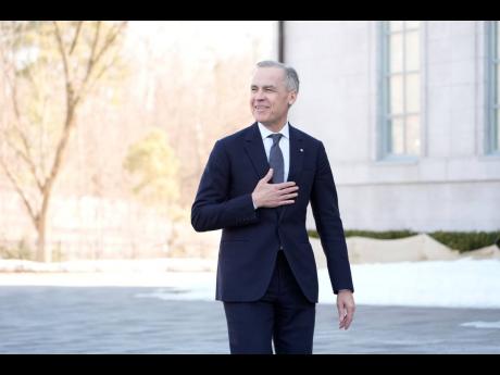 Prime minister-designate Mark Carney arrives for a swearing in ceremony at Rideau Hall in Ottawa on Friday, March 14, 2025. (Adrian Wyld /The Canadian Press via AP)