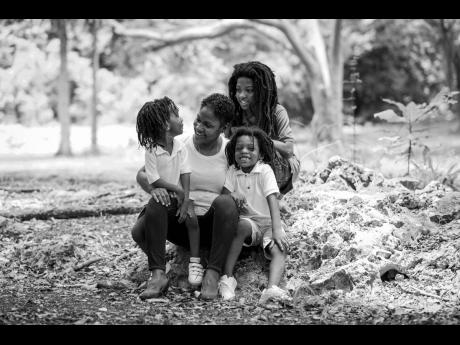 Mother of three, the doctor with her sons (from left) Kyan, Omowale and Negasi.