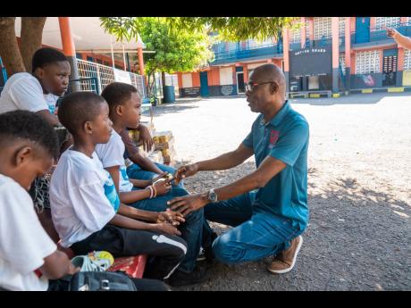 The Desnoes & Geddes (D&G) Foundation, through its ‘No Male Left Behind’ initiative, reinforced its commitment to youth empowerment on Boys’ Day at Cockburn Gardens Primary & Junior High School. Male volunteers from the foundation engaged boys from g