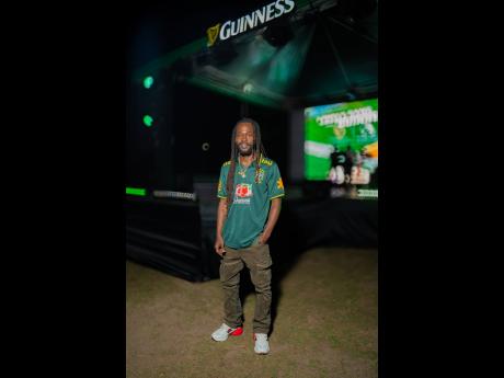 Jesse Royal, Grammy-nominated singer/songwriter, pulls off a relaxed look for his performance.