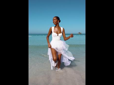 Williams makes a splash in Alexandra Miro’s white maillot and Elena tulle skirt.