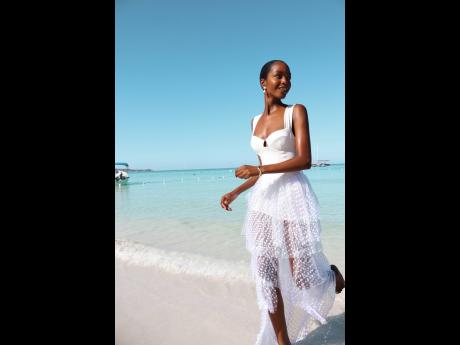 Miqueal Symone Williams in Alexandra Miro’s maillot and Elena skirt.
