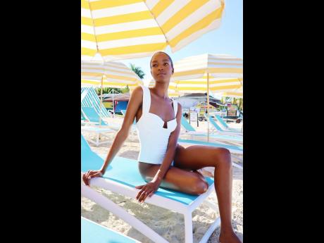 Taking shade, a yellow-striped umbrella covers a glowing Williams.