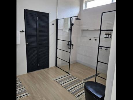 A walk-in rain shower bathroom.