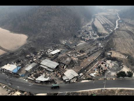A burnt-out houses and warehouses in a destroyed village are seen in Andong, South Korea, Thursday, March 27, 2025. (Kim Do-hun/Yonhap via AP)