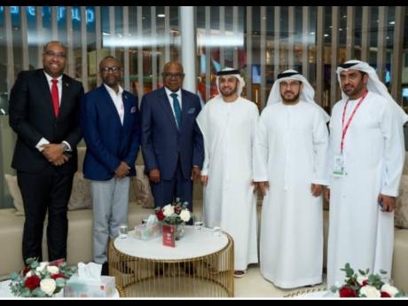 In this May 2024 photo, Jamaica’s Tourism Minister Edmund Bartlett (third left) shares a moment with senior Emirates Airline executives Sheikh Majid Al Mualla (fourth left), Kahlid Bel Jaflah (fifth left), and Oman  (right), following partnership discuss