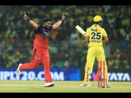 
Royal Challengers Bengaluru’s Yash Dayal celebrates the dismissal of Chennai Super Kings’ Shivam Dube (right) during their Indian Premier League cricket at M. A. Chidambaram Stadium in Chennai, India, on Friday.
