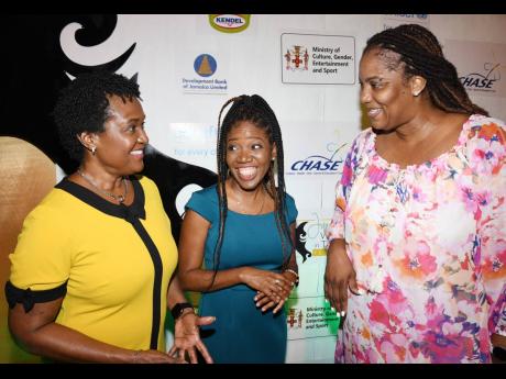 Sharon Smith (left), head of business banking at JN Bank, has the attention of theatre and media expert and businesswoman, Dahlia Harris (right), and Nickesha Barrett, relationship executive at the Development Bank of Jamaica, ahead of the panel discussion