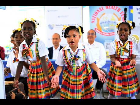 Students from Frankfield Primary School perform a cultural piece at the official reopening of the Frankfield Health Centre in Clarendon last Friday.