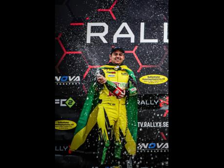 Fraser McConnell celebrates a second-place finish in the Open 4WD Pro Class in round one of the RallyX Series in Portugal on Saturday. 
