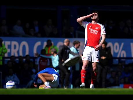 Arsenal’s Declan Rice reacts during a stop in play during the English Premier League football match against Everton at Goodison Park, Liverpool, England yesterday.