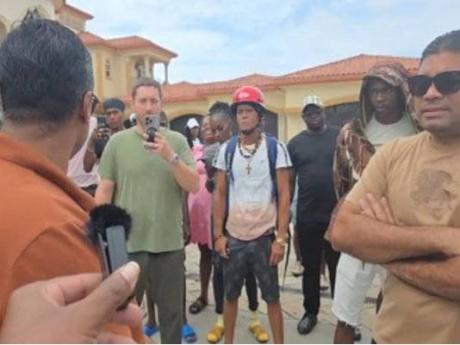 Part of the crowd at Azruddin Mohamed’s residence when Guyana Revenue Authority officers went there on Saturday, April 5.