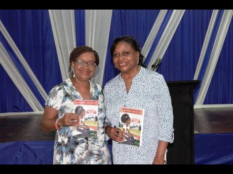 Maureen Linton (left) and Flo Garth at the book launch, held at the Jamaica Library Service at Tom Redcam Avenue.