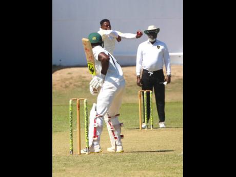 Kingston CC batsman Romaine Morris gets ready to face a delivery from JDF fast bowler Sheldon Cottrell during their JCA Michael Holding Senior Cup match at Sabina Park over the weekend.