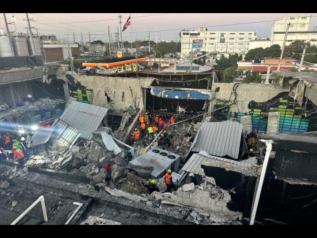 Rescue workers search for survivors at the Jet Set nightclub after its roof collapsed during a concert in Santo Domingo, Dominican Republic, early Tuesday, April 8, 2025. (Noticias SIN via AP)